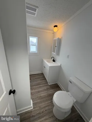 a bathroom with a toilet and a sink