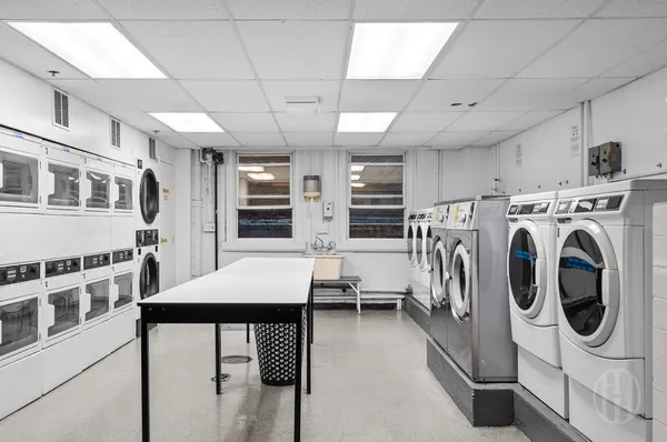 a front view of a building with a garden