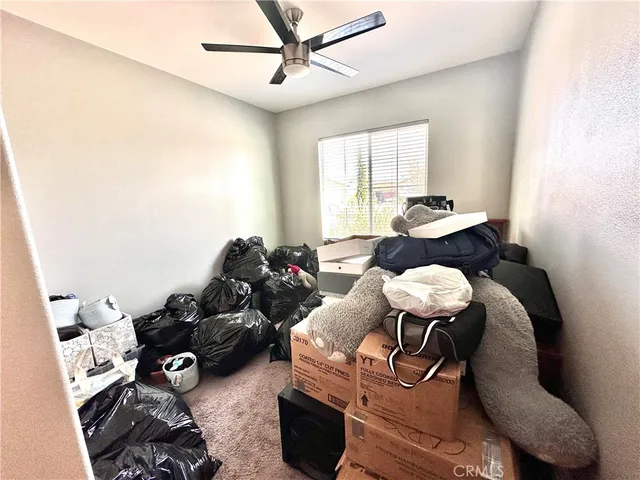 a bedroom with a workspace