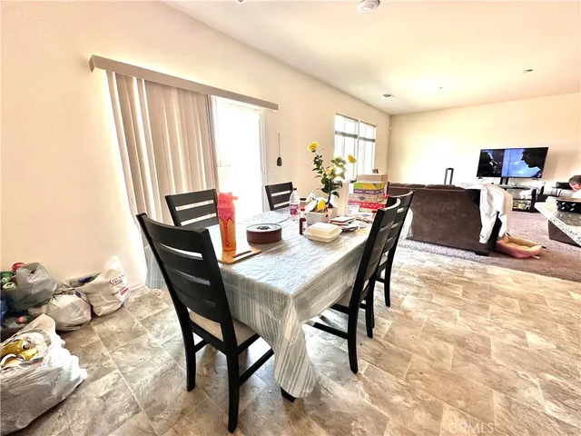 a room with a bed and a chandelier