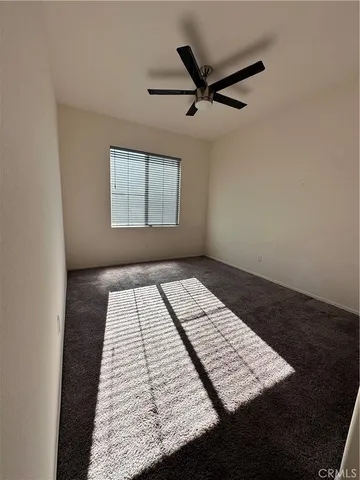 a bedroom with bed and window