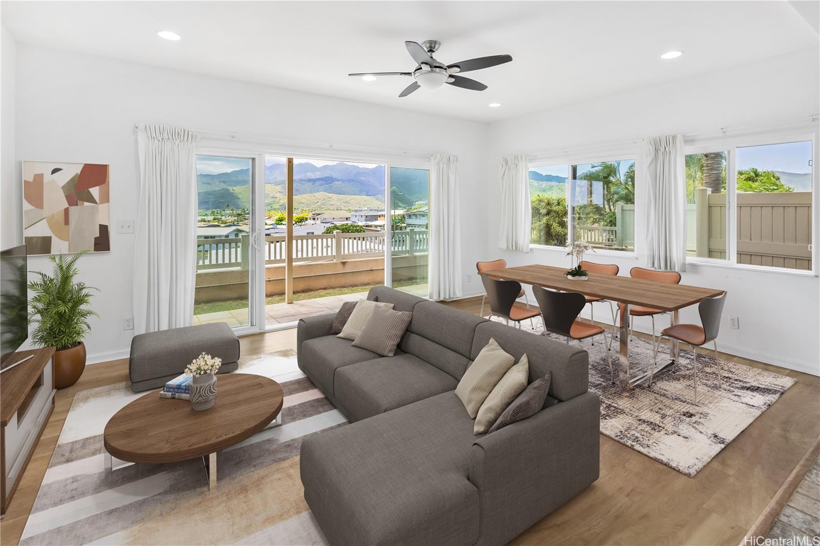 232 Hanakoa Place, Unit A Honolulu, HI 96825 - Photo 1 of 1 a living room with furniture and a large window