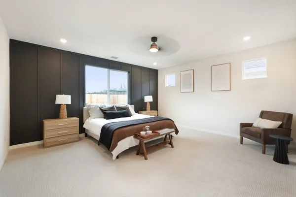 a bedroom with bed and window