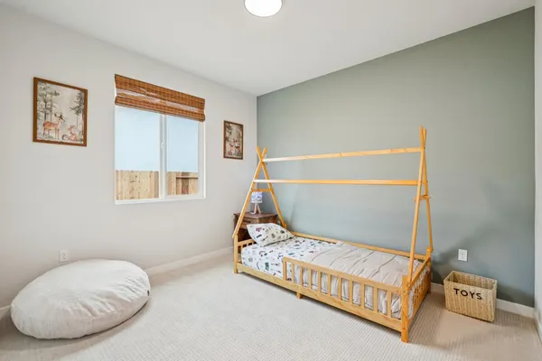 a bedroom with a bed and a couch