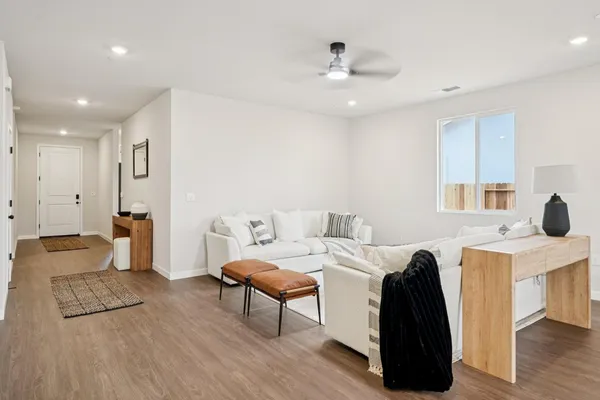 a living room with furniture and a table