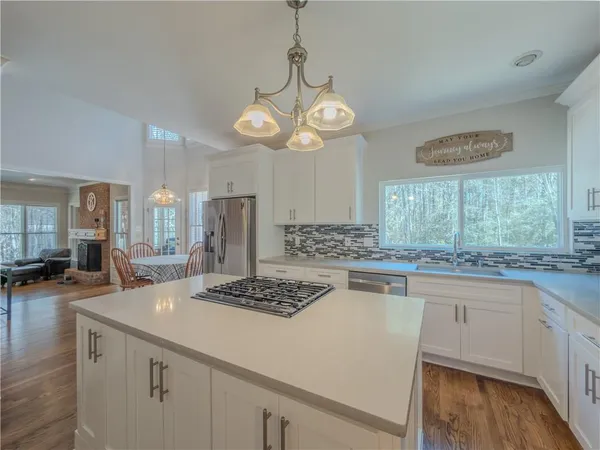 a kitchen with a stove and a refrigerator