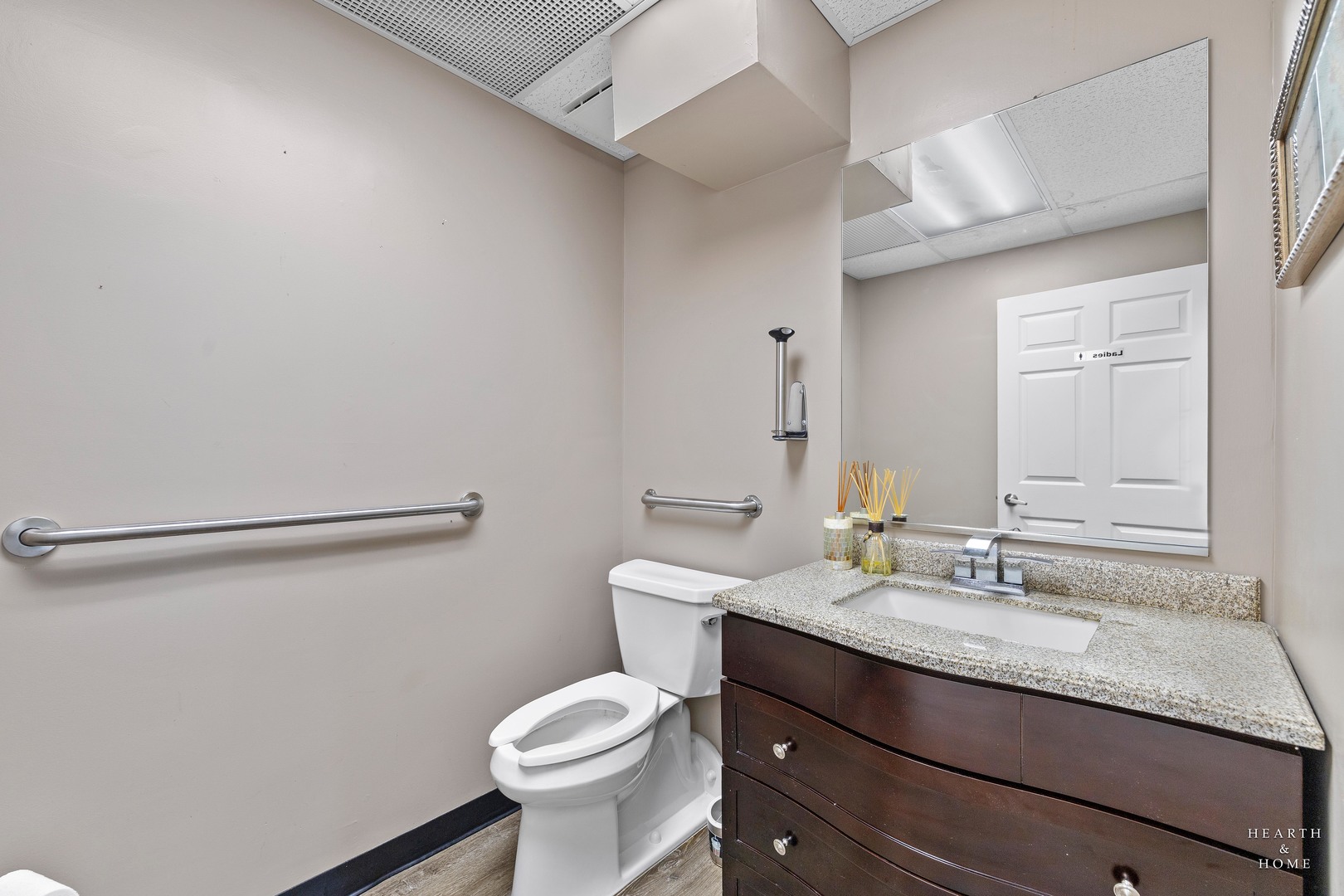 5214 State Rte 31 Crystal Lake, IL 60012 - Photo 14 of 30 a bathroom with a granite countertop sink a toilet and a mirror