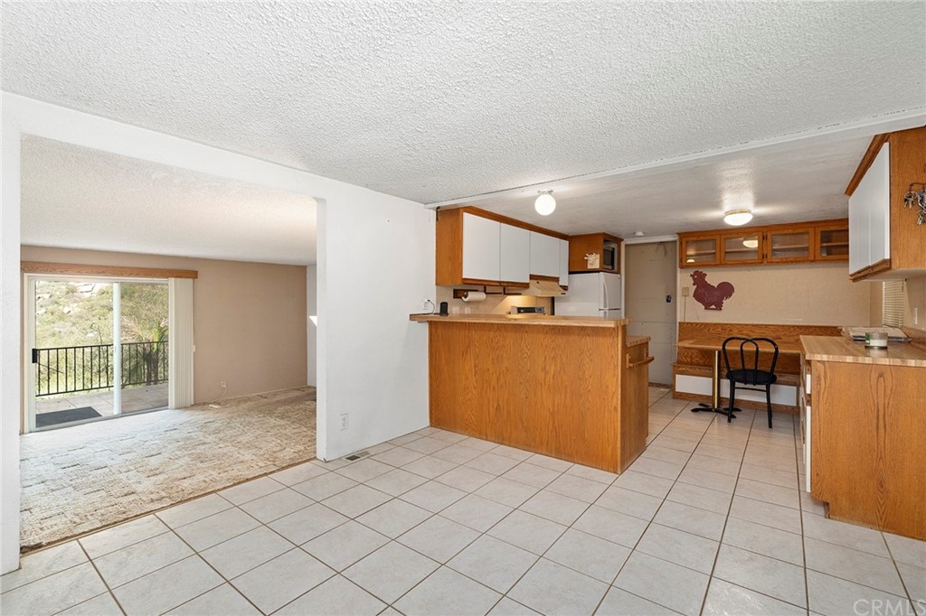 46970 Rainbow Canyon Road Temecula, CA 92592 - Photo 11 of 34 a view of kitchen with furniture and window