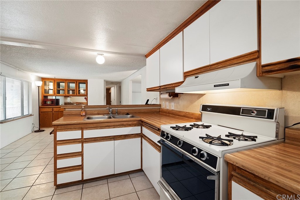 46970 Rainbow Canyon Road Temecula, CA 92592 - Photo 15 of 34 a kitchen with a stove and a sink