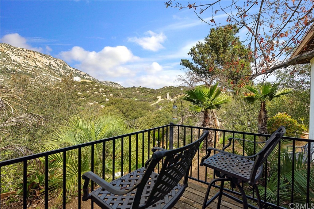 46970 Rainbow Canyon Road Temecula, CA 92592 - Photo 28 of 34 a view of a balcony with wooden floor and a bench