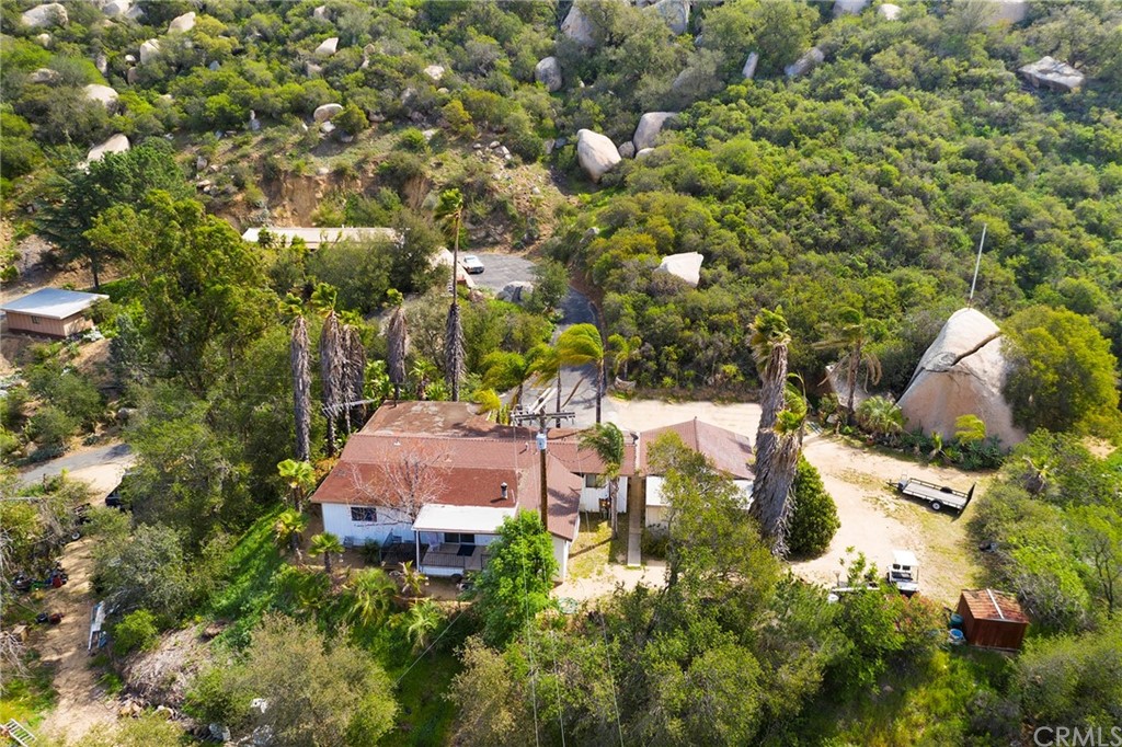 46970 Rainbow Canyon Road Temecula, CA 92592 - Photo 32 of 34 a view of a house with a yard and sitting area