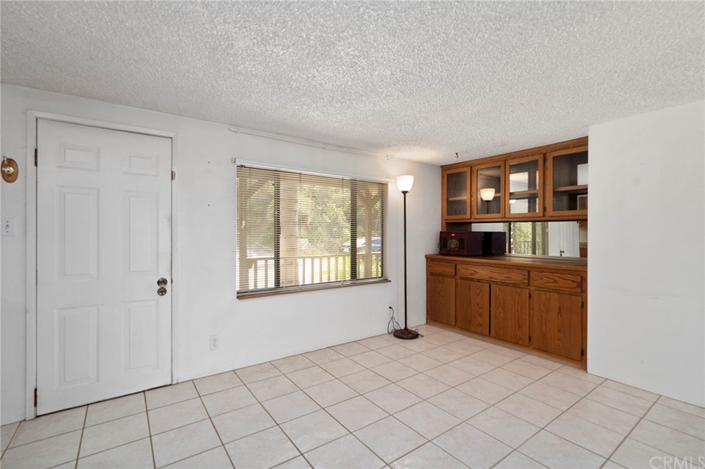 46970 Rainbow Canyon Road Temecula, CA 92592 - Photo 9 of 34 a bedroom with a bed and a window