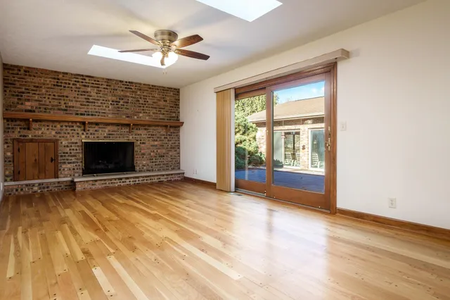 a view of a livingroom with a furniture and chandelier fan