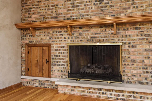 an empty room with a ceiling fan and a window