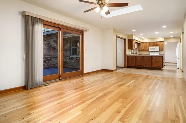 a view of a room with wooden floor