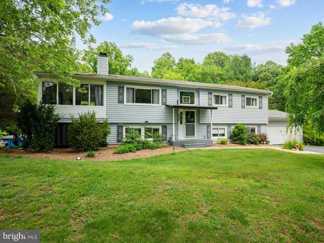 a front view of a house with a yard and porch