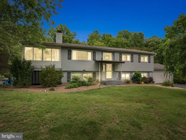a living room with fireplace furniture and a flat screen tv