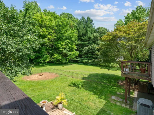 a view of a dining room with furniture wooden floor and chandelier