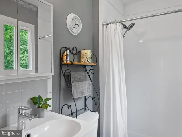 a view of a garden with an outdoor seating