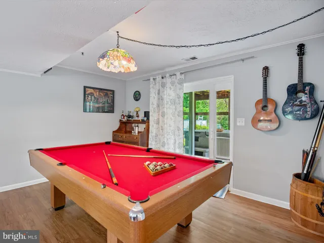 a living room with furniture a rug and a chandelier