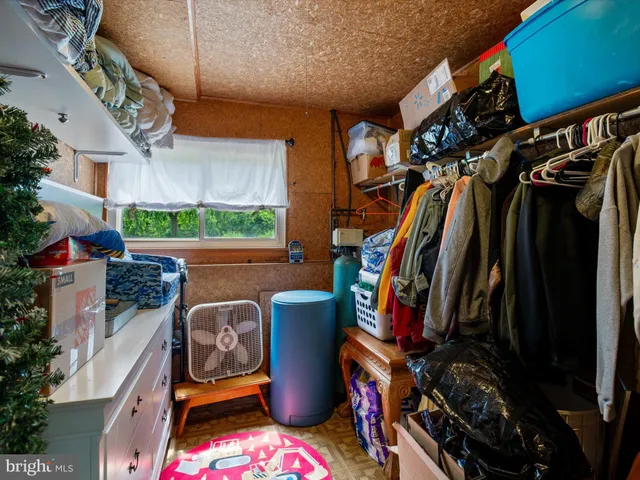 a view of storage and utility room with washer and dryer