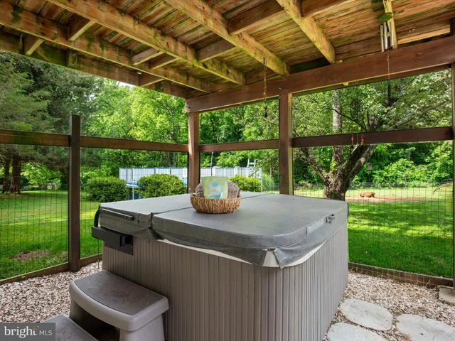 a view of a deck with chairs and wooden floor