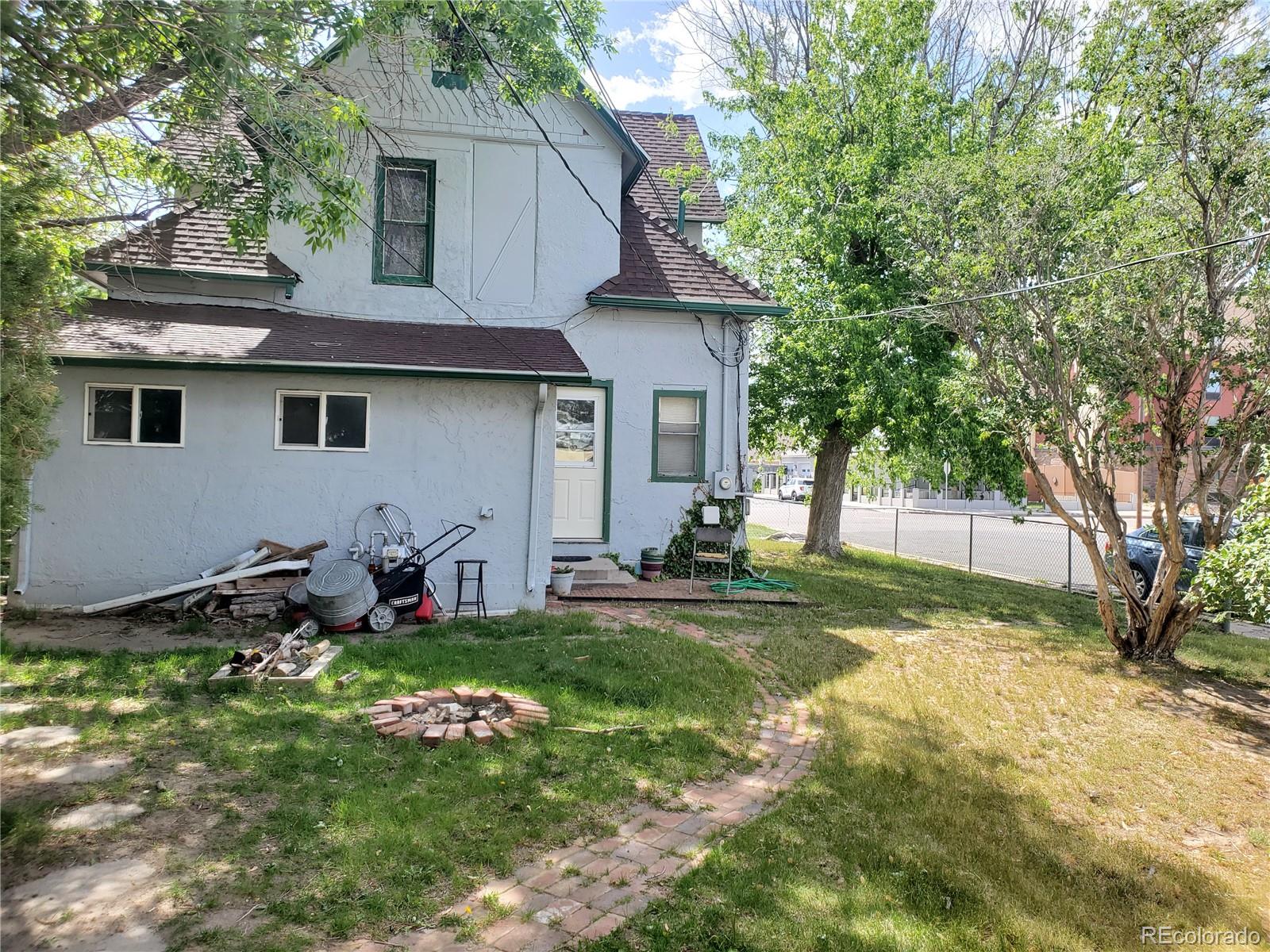 1012 State Street Fort Morgan, CO 80701 - Photo 3 of 18 a view of a house with backyard and sitting area
