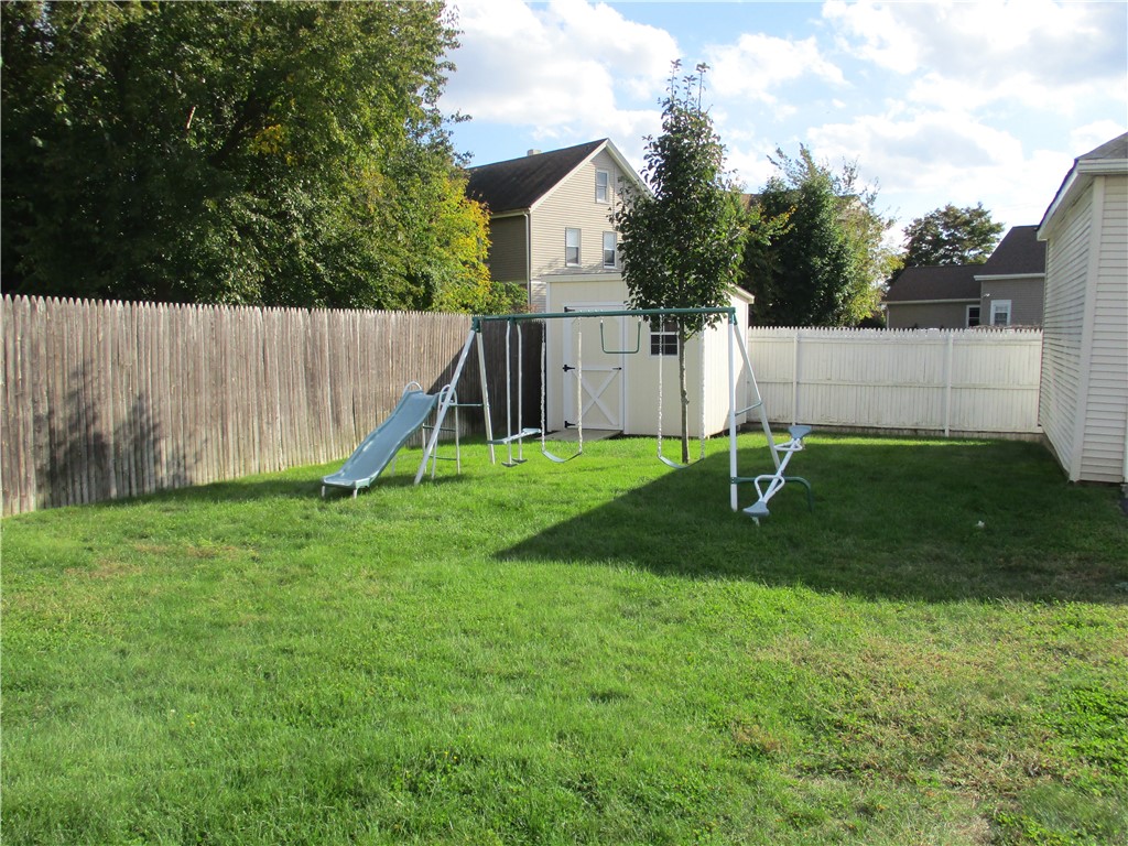 19 Gooding Street Pawtucket, RI 02860 - Photo 14 of 49 FULLY FENCED YARD WITH MANICURED LAWN