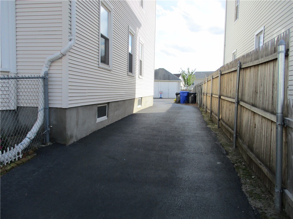 19 Gooding Street Pawtucket, RI 02860 - Photo 8 of 49 NICELY PAVED DRIVEWAY TO THE BACKYARD