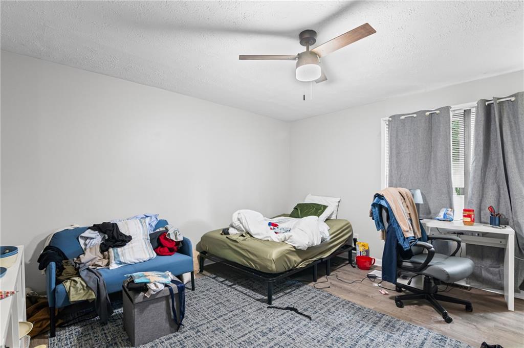 877 Beckwith Street Southwest Atlanta, GA 30314 - Photo 17 of 28 a bedroom with furniture and a window