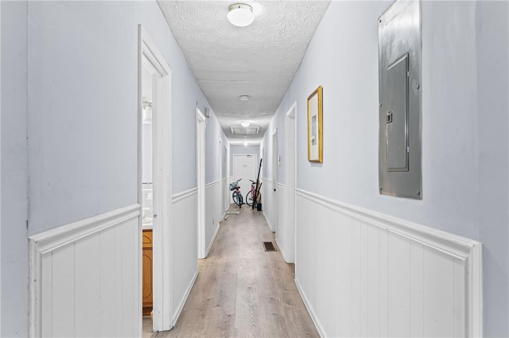 877 Beckwith Street Southwest Atlanta, GA 30314 - Photo 23 of 28 a view of hallway with wooden floor