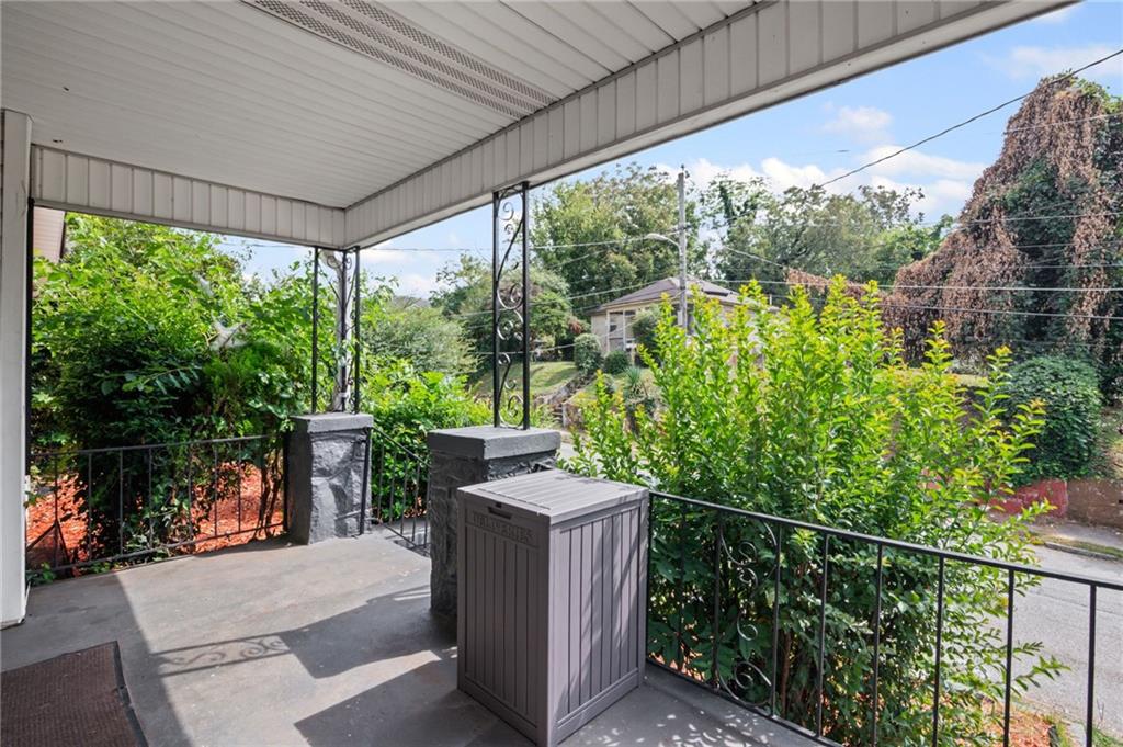 877 Beckwith Street Southwest Atlanta, GA 30314 - Photo 3 of 28 a backyard of a house with lake view and a potted plant