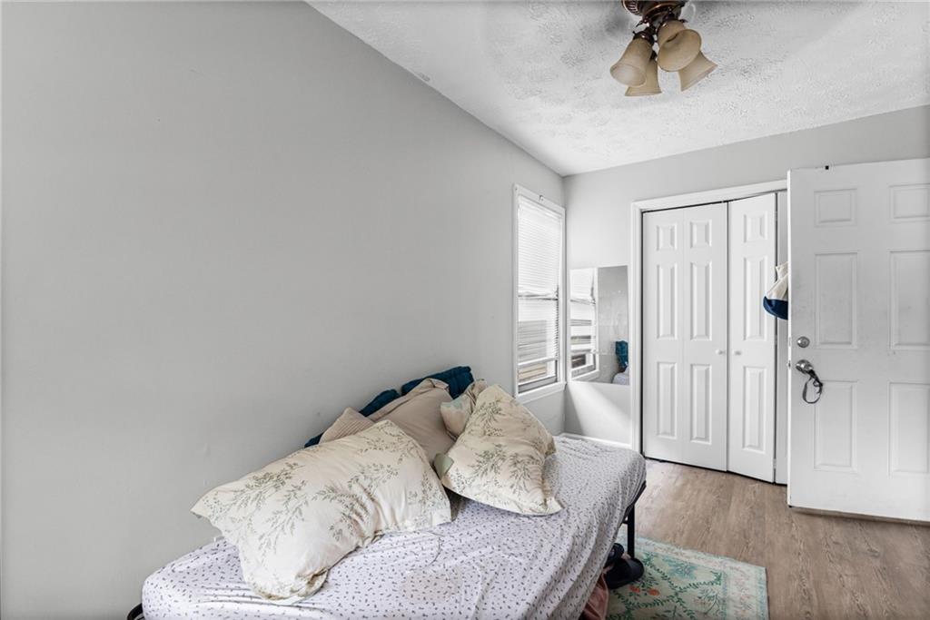 877 Beckwith Street Southwest Atlanta, GA 30314 - Photo 6 of 28 a living room with furniture and a ceiling fan