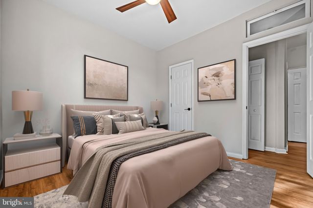 a bedroom with bed and a window