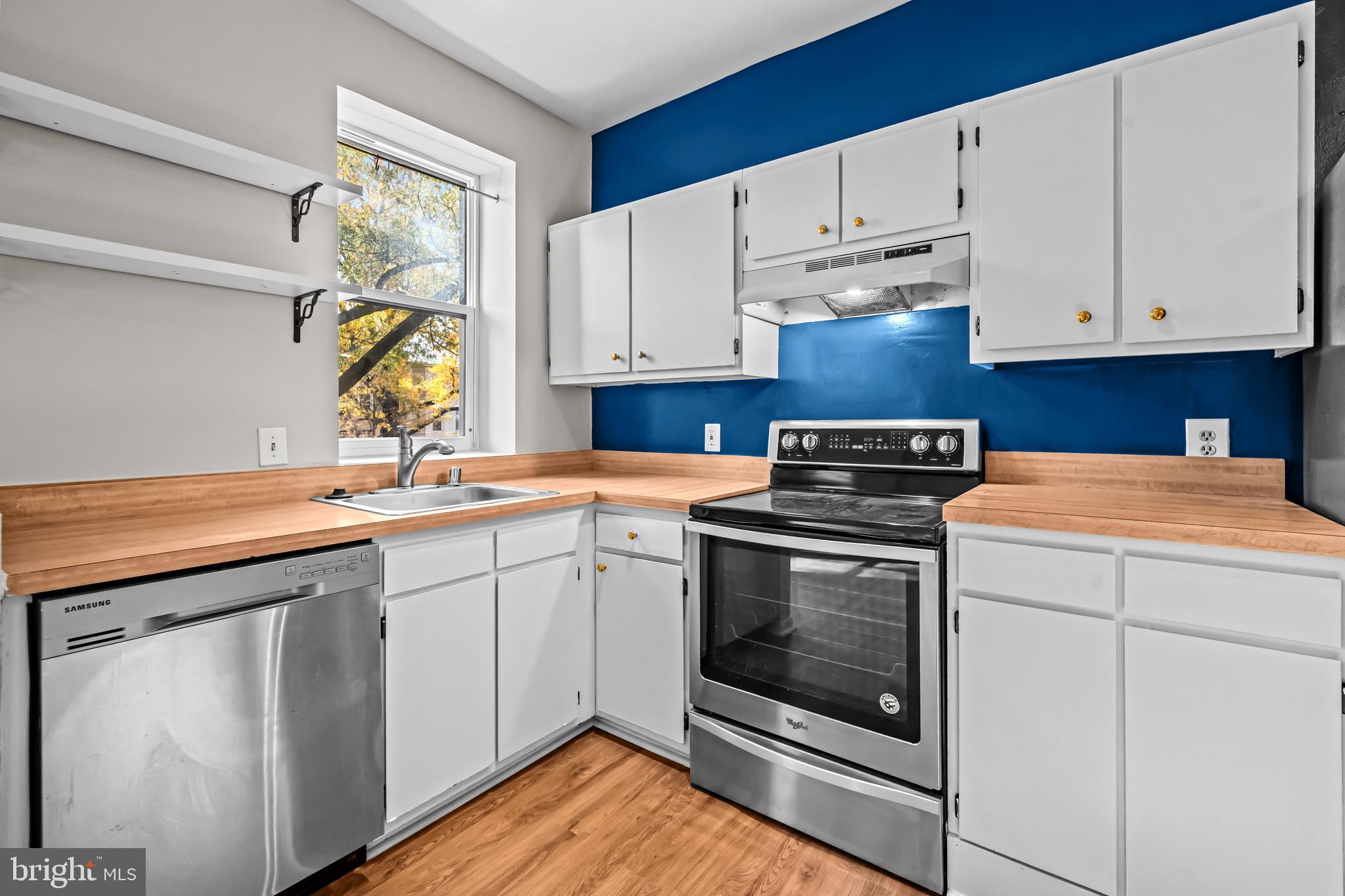 5 Rhode Island Avenue Northwest, Unit 202 Washington, DC 20001 - Photo 11 of 17 a kitchen with cabinets appliances and a sink