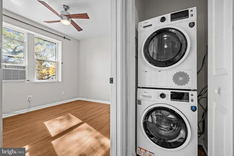 a bedroom with bed and painting on the wall
