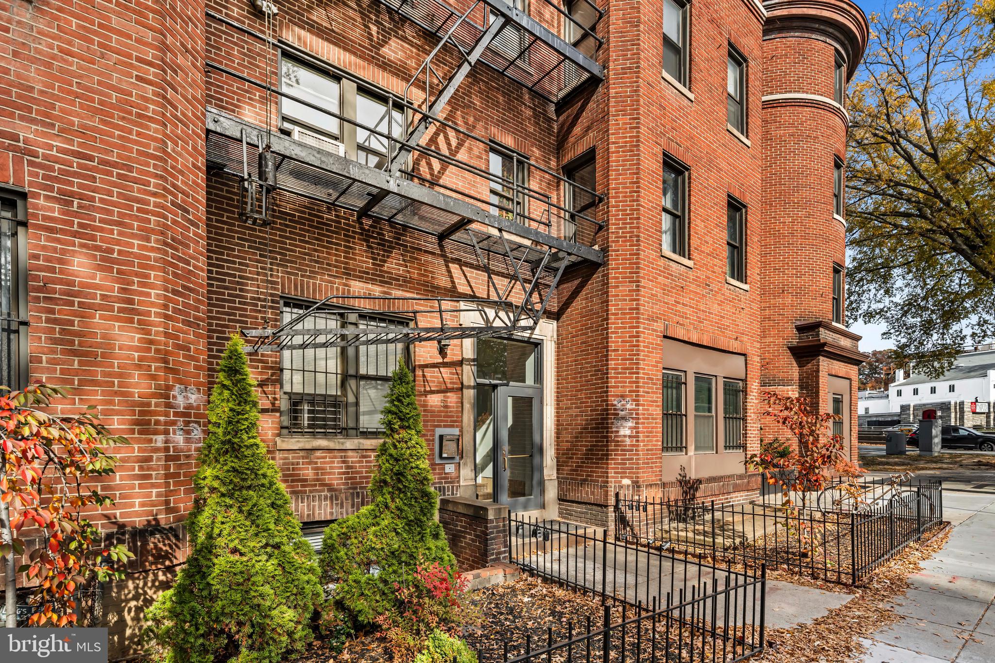 5 Rhode Island Avenue Northwest, Unit 202 Washington, DC 20001 - Photo 3 of 17 a view of a brick building with many windows