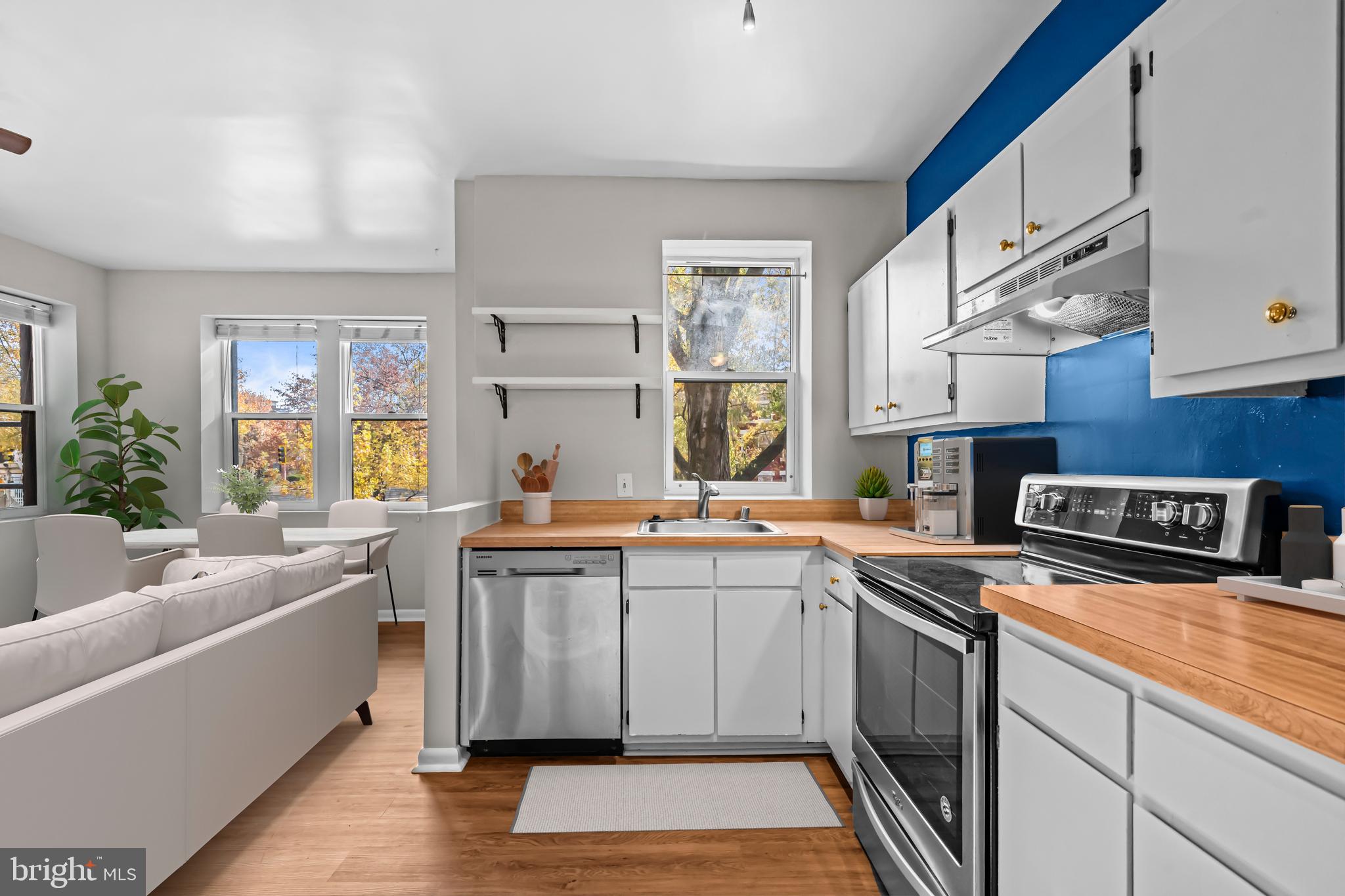 5 Rhode Island Avenue Northwest, Unit 202 Washington, DC 20001 - Photo 4 of 17 a kitchen that has a sink and a stove in it