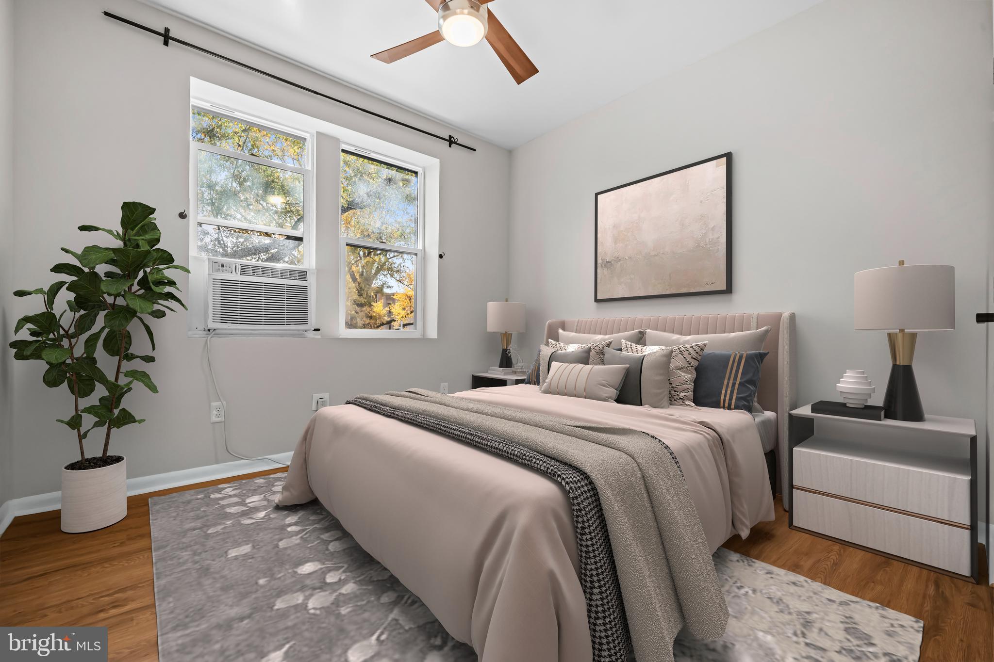 5 Rhode Island Avenue Northwest, Unit 202 Washington, DC 20001 - Photo 8 of 17 a bedroom with bed and a window