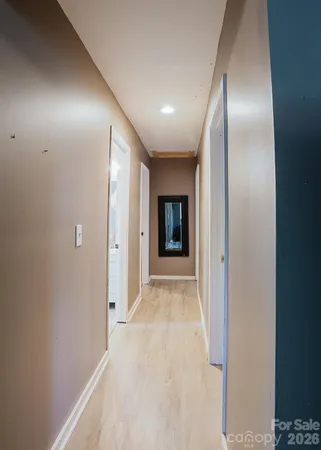 a view of hallway with granite countertop