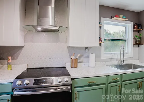 a kitchen with a stove and a sink