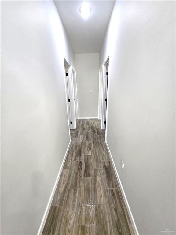 913 North Clarence Avenue, Unit 3 Edinburg, TX 78541 - Photo 6 of 11 a view of a hallway with wooden floor