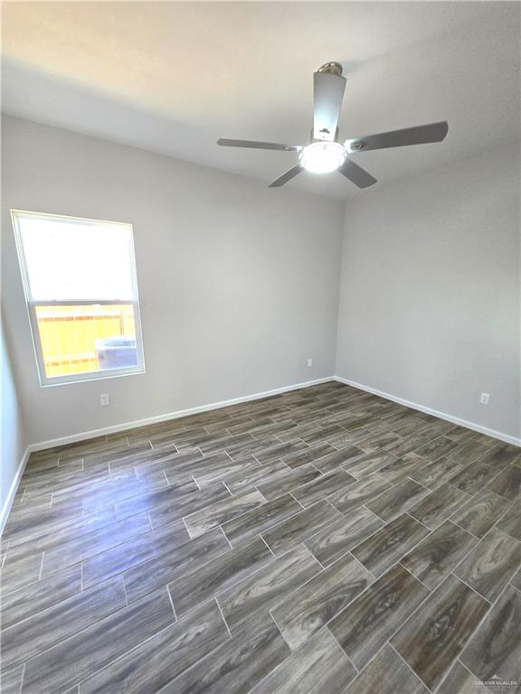 913 North Clarence Avenue, Unit 3 Edinburg, TX 78541 - Photo 9 of 11 wooden floor in an empty room