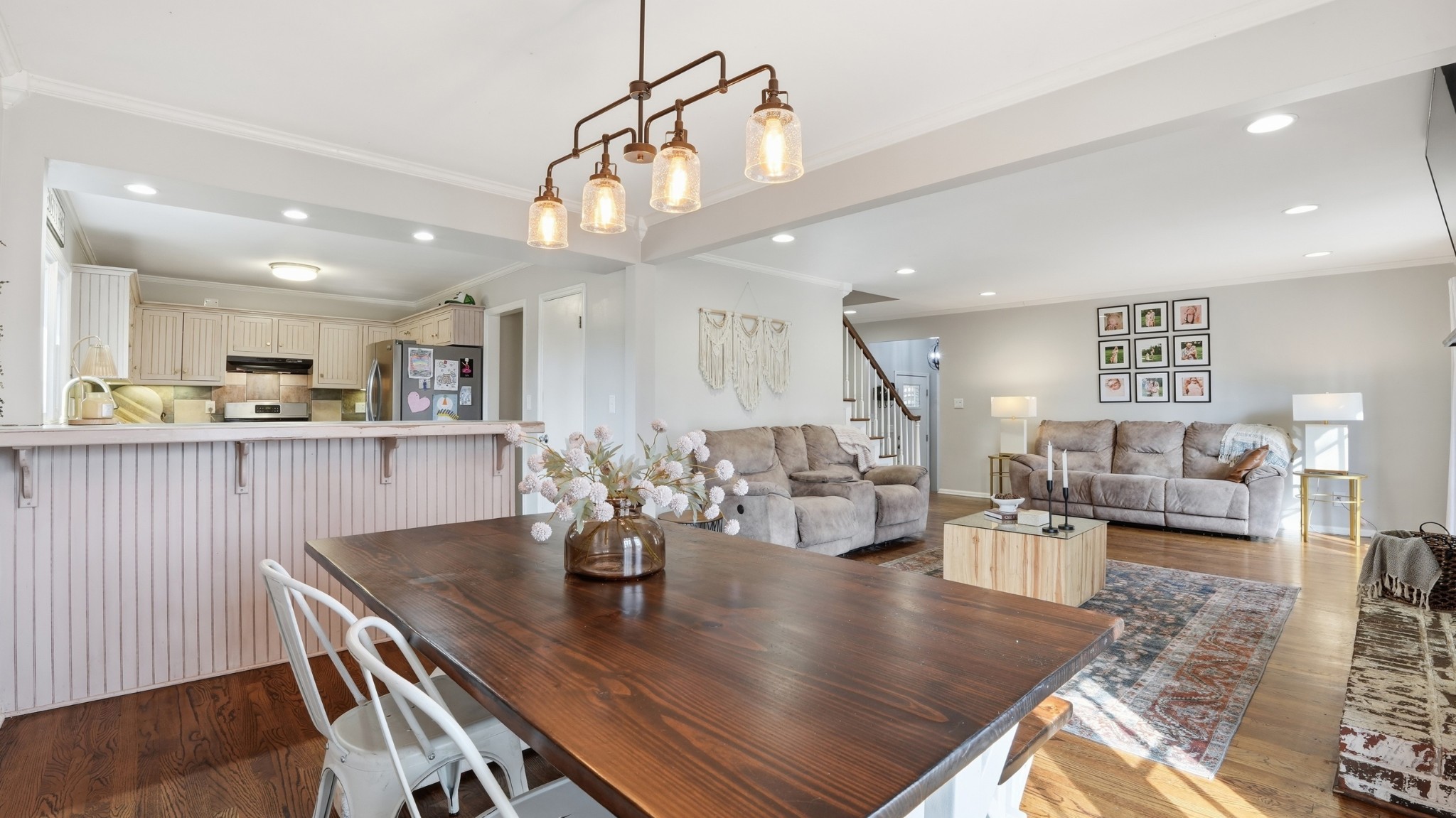 270 Wood Bluff Road Winchester, TN 37398 - Photo 14 of 55 a view of a dining room and livingroom with furniture wooden floor a chandelier