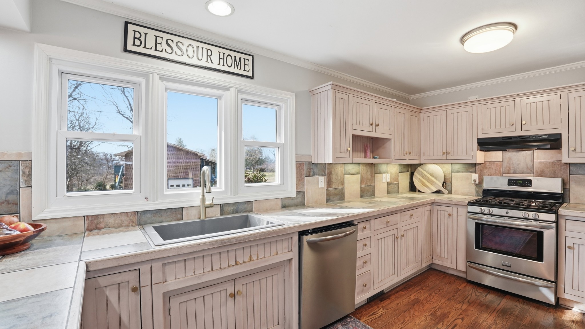 270 Wood Bluff Road Winchester, TN 37398 - Photo 17 of 55 a kitchen with stainless steel appliances granite countertop a stove a sink and a microwave
