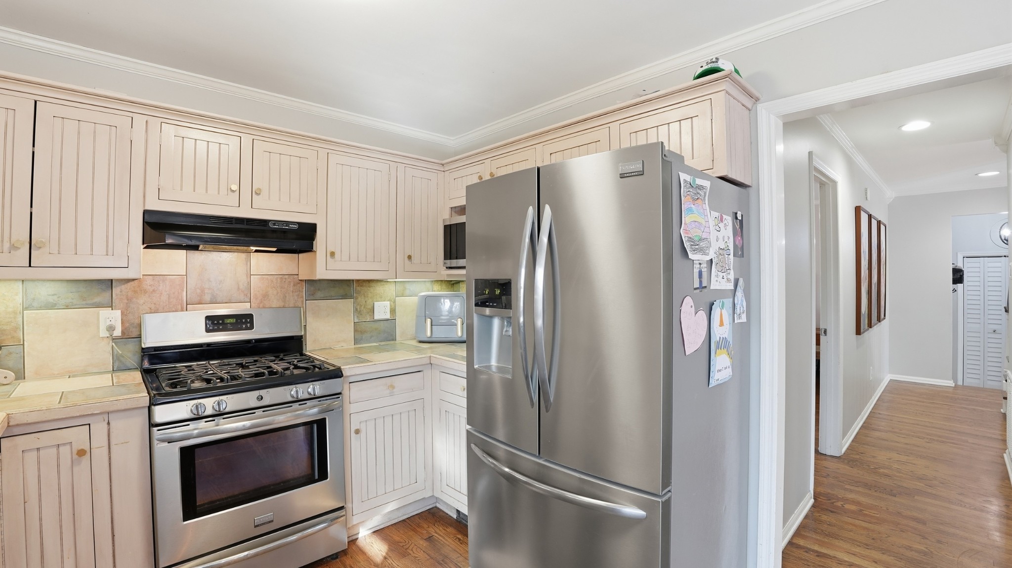 270 Wood Bluff Road Winchester, TN 37398 - Photo 18 of 55 a kitchen with stainless steel appliances a refrigerator a stove and white cabinets