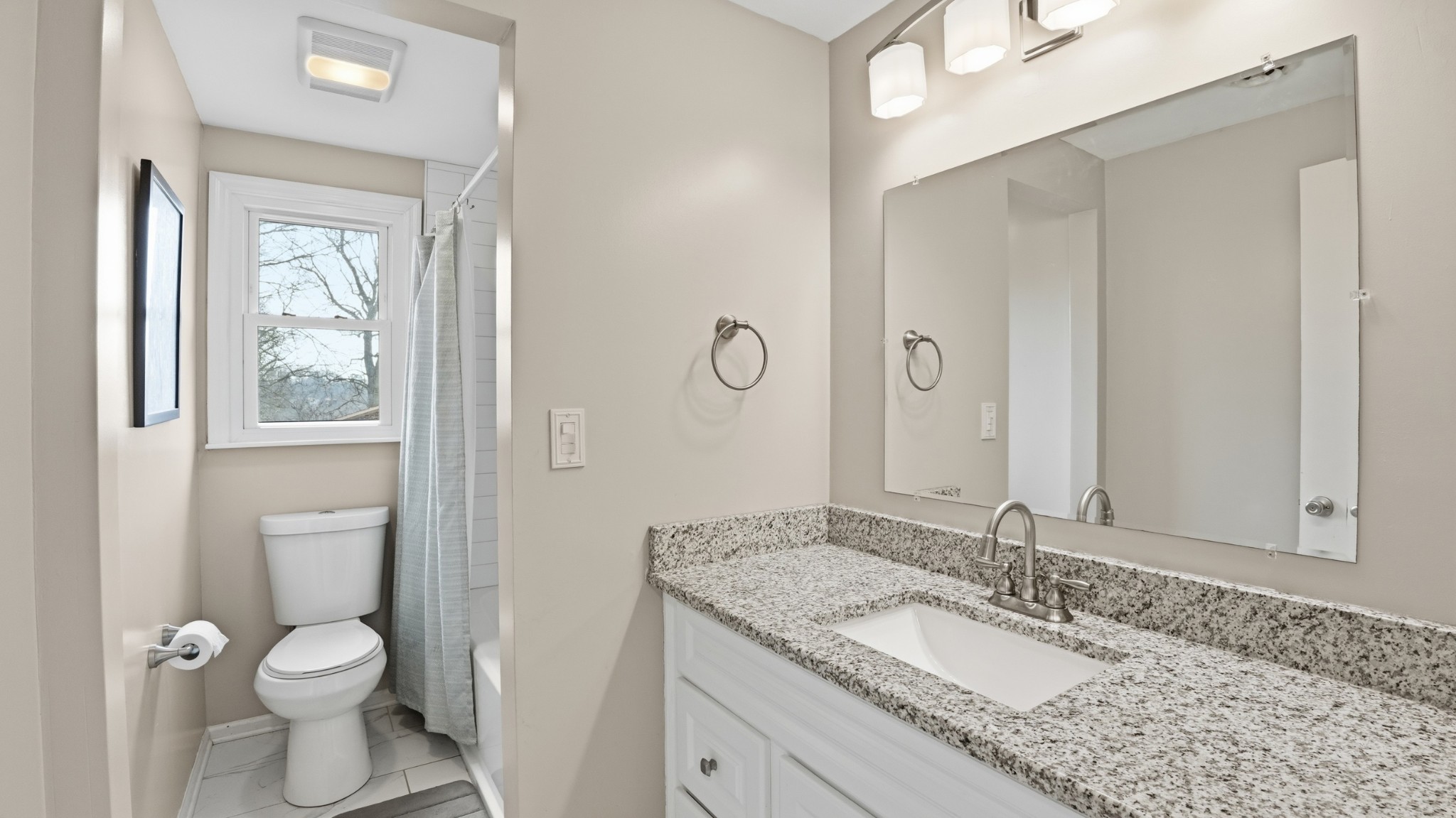 270 Wood Bluff Road Winchester, TN 37398 - Photo 28 of 55 a bathroom with a granite countertop toilet a sink and a mirror