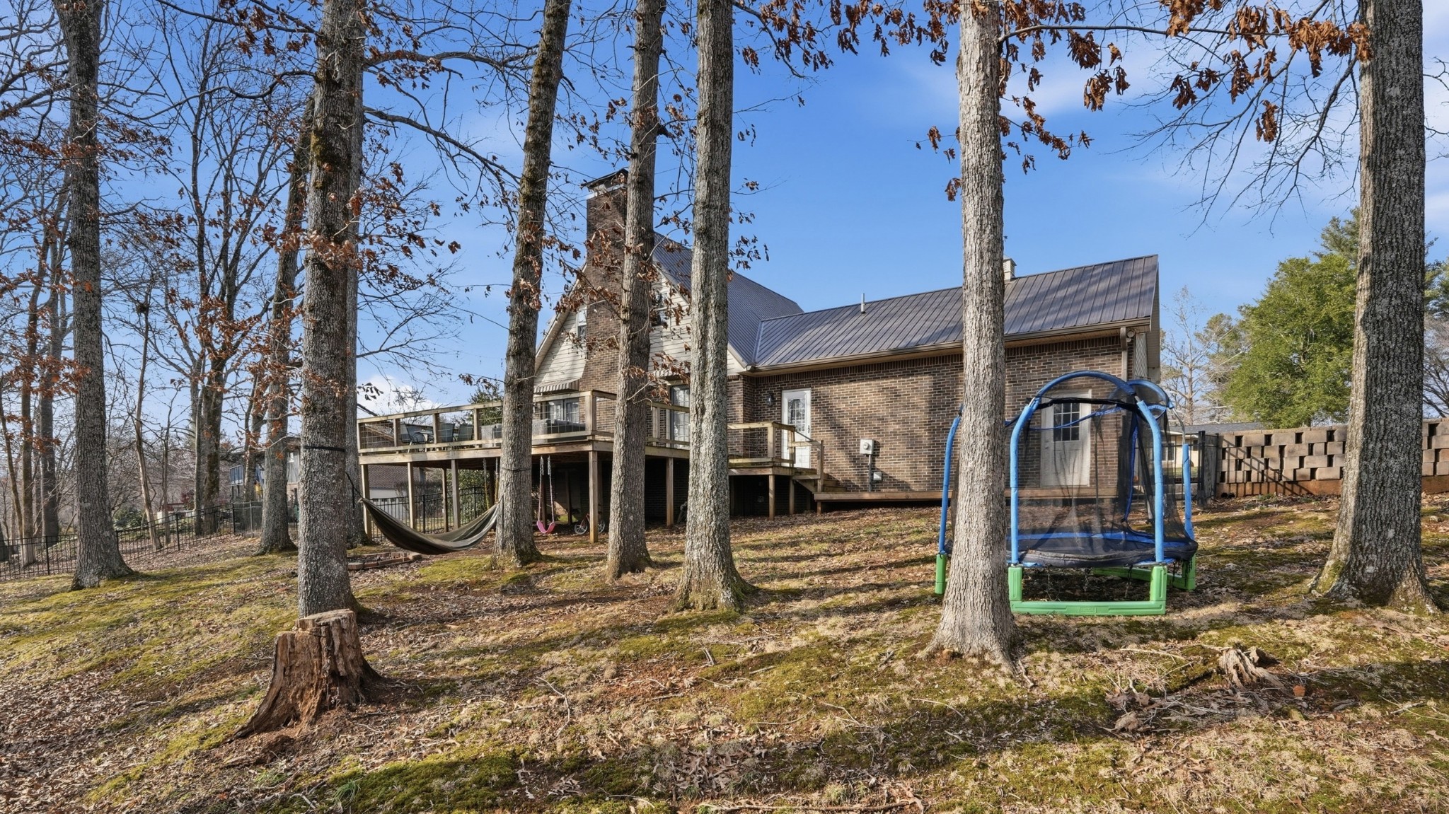 270 Wood Bluff Road Winchester, TN 37398 - Photo 44 of 55 a view of a wooden house with a large tree and wooden fence