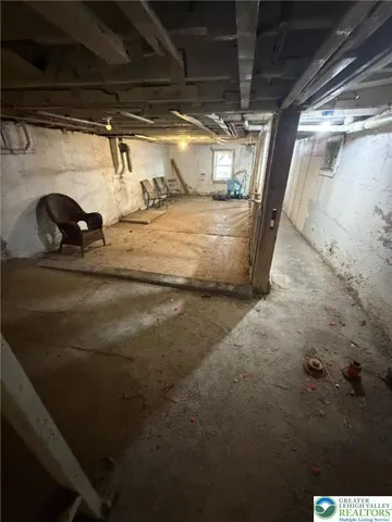 a view of a hallway with wooden furniture