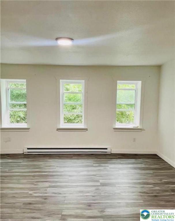 731 North Front Street Allentown, PA 18102 - Photo 4 of 22 an empty room with wooden floor